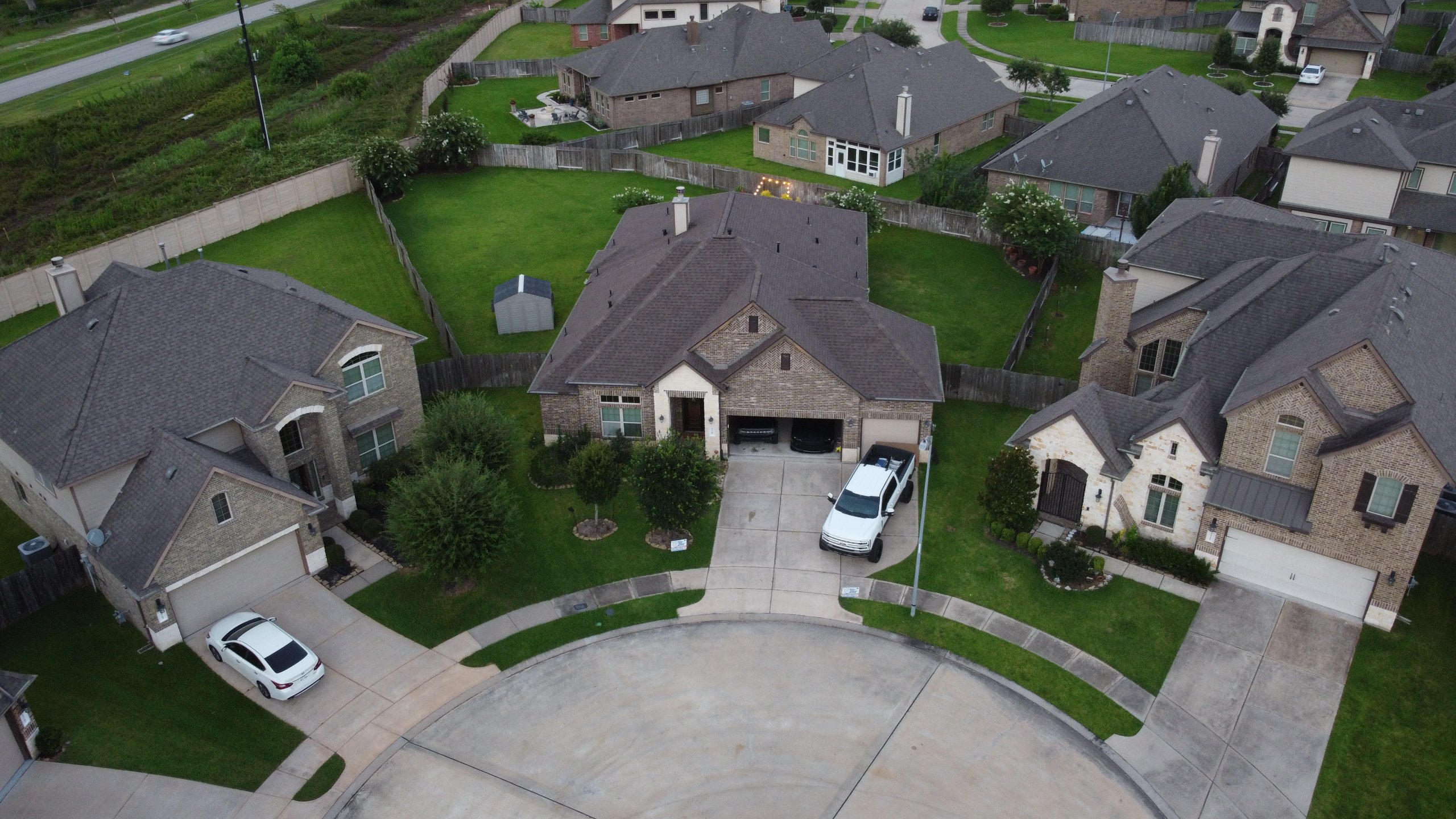 Aerial view of a completed Class 4 impact-resistant roof replacement in Sugar Land, TX.