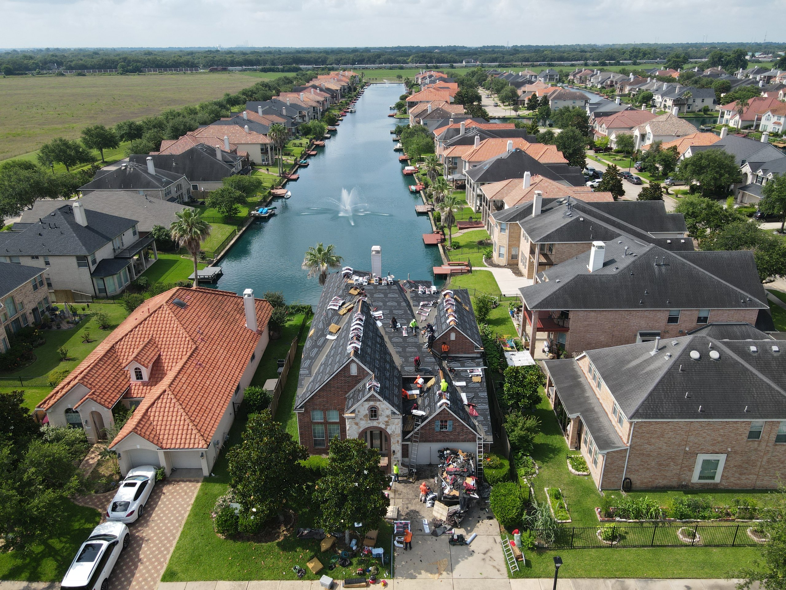 Aerial view of a completed roof replacement on a home in Houston, TX.