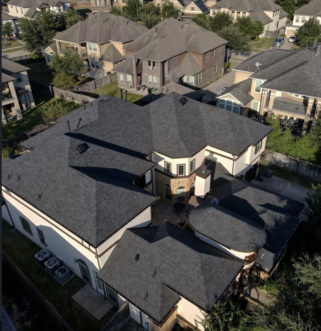 Aerial view of a roof replacement in progress in the Avalon community.