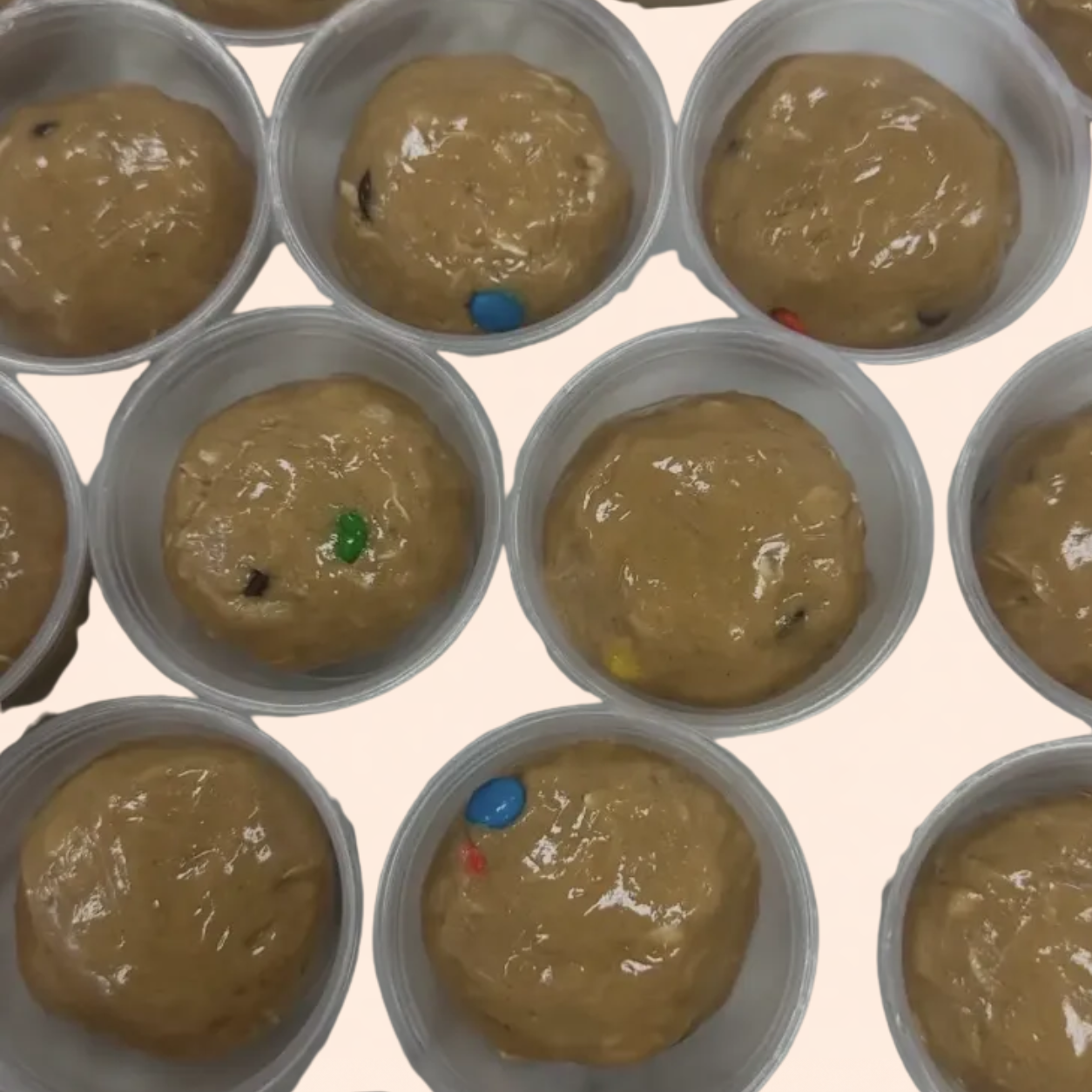 A tray of Monster Cookie protein balls rolled in oats and chocolate chips