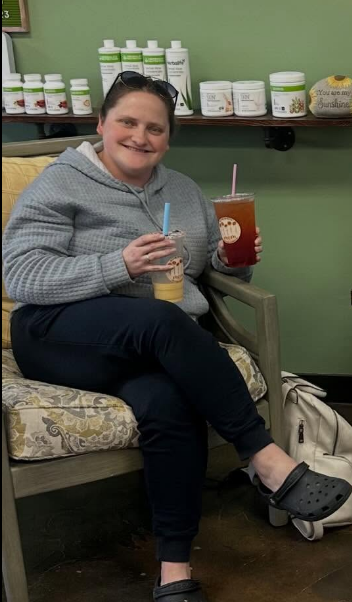 Customer holding a drink at Restore Nutrition in Plymouth, MN