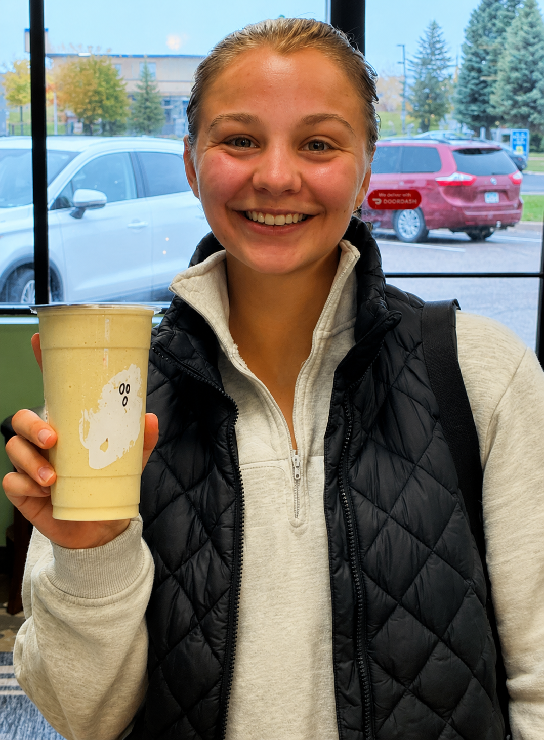 Customer holding a drink at Restore Nutrition in Plymouth, MN