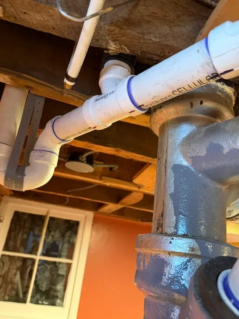 New PVC drain line connected to cast iron stack