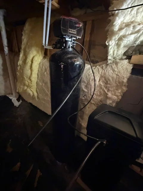 New water softener system installed in crawlspace