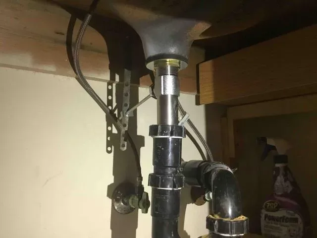 Under-sink drain and trap repair by Graham Plumbing