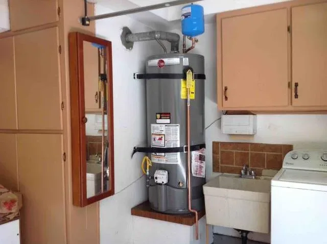 Water heater installed in a laundry room by Graham Plumbing
