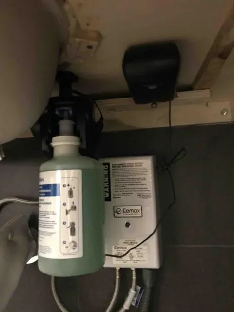Under-sink plumbing work by Graham Plumbing