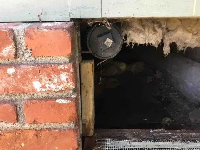 Crawlspace access for an under-house repair by Graham Plumbing