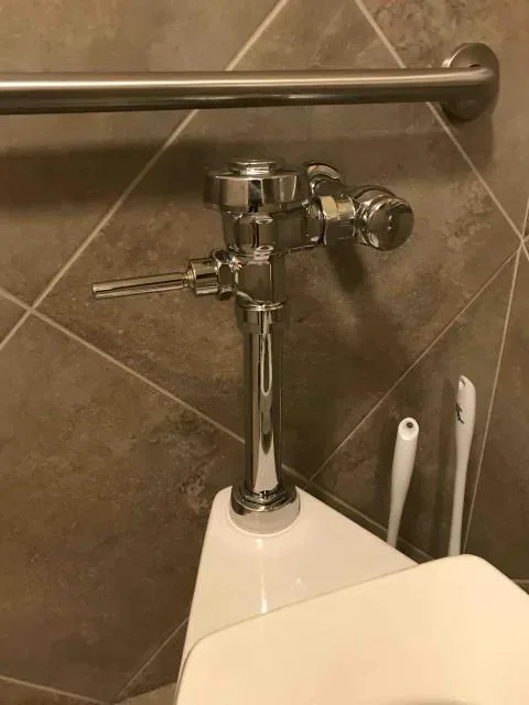 Commercial flushometer repair by Graham Plumbing