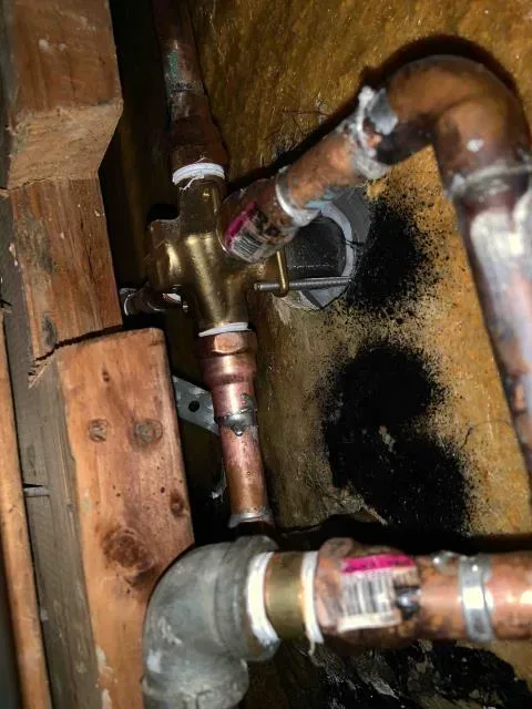 Copper repair inside an opened wall by Graham Plumbing