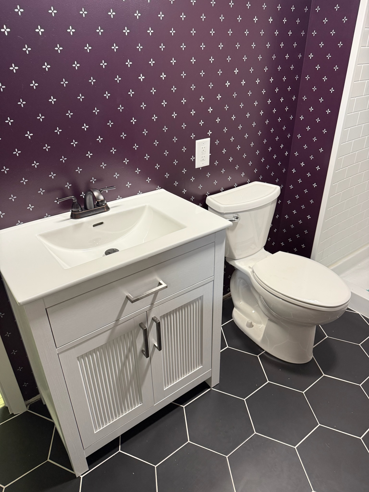 Bathroom vanity and toilet reset after new tile work completed by Twin City Pipeworks in White Bear, MN
