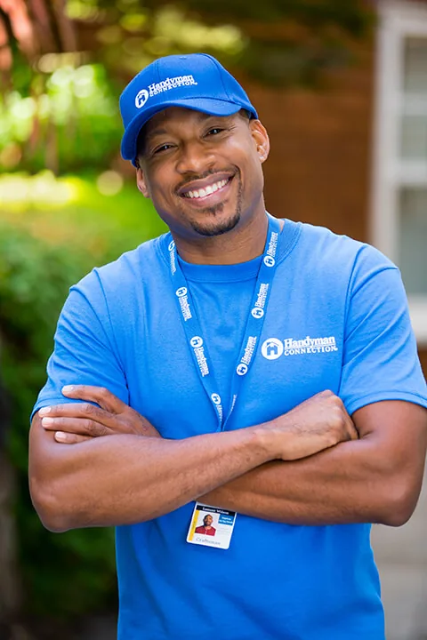 Smiling Handyman Connection craftsman with arms crossed