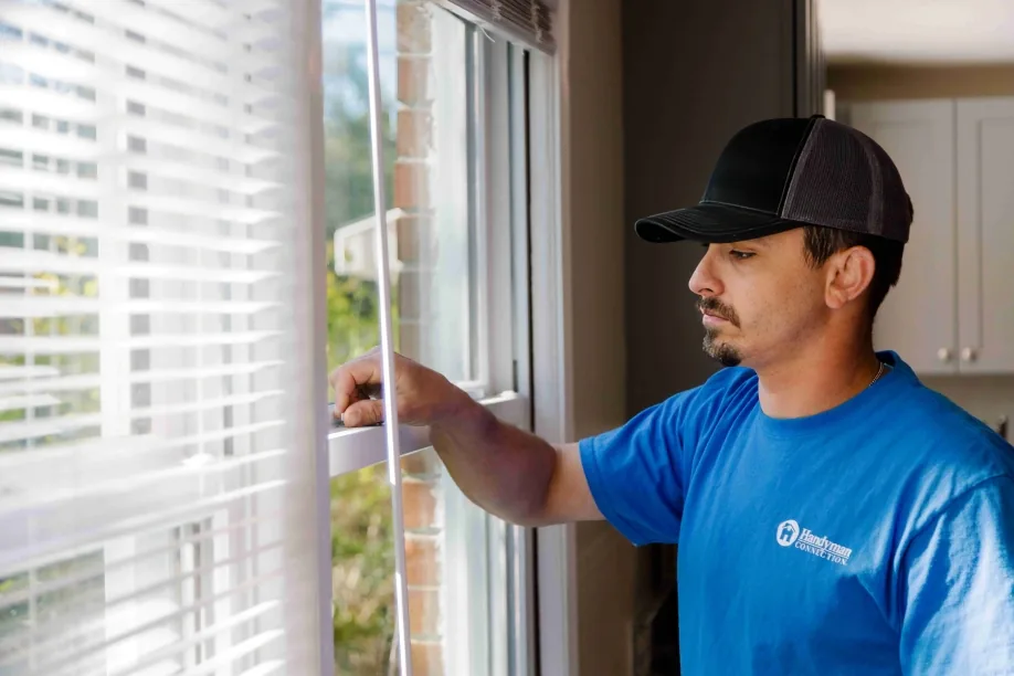 Craftsman checking a window sash