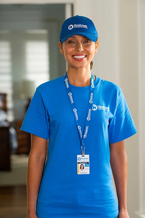 Handyman Connection craftswoman in a company shirt and lanyard