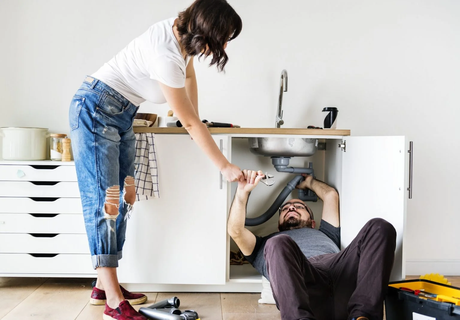 Under-sink supply and drain work during a fixture installation for an Iron County kitchen.