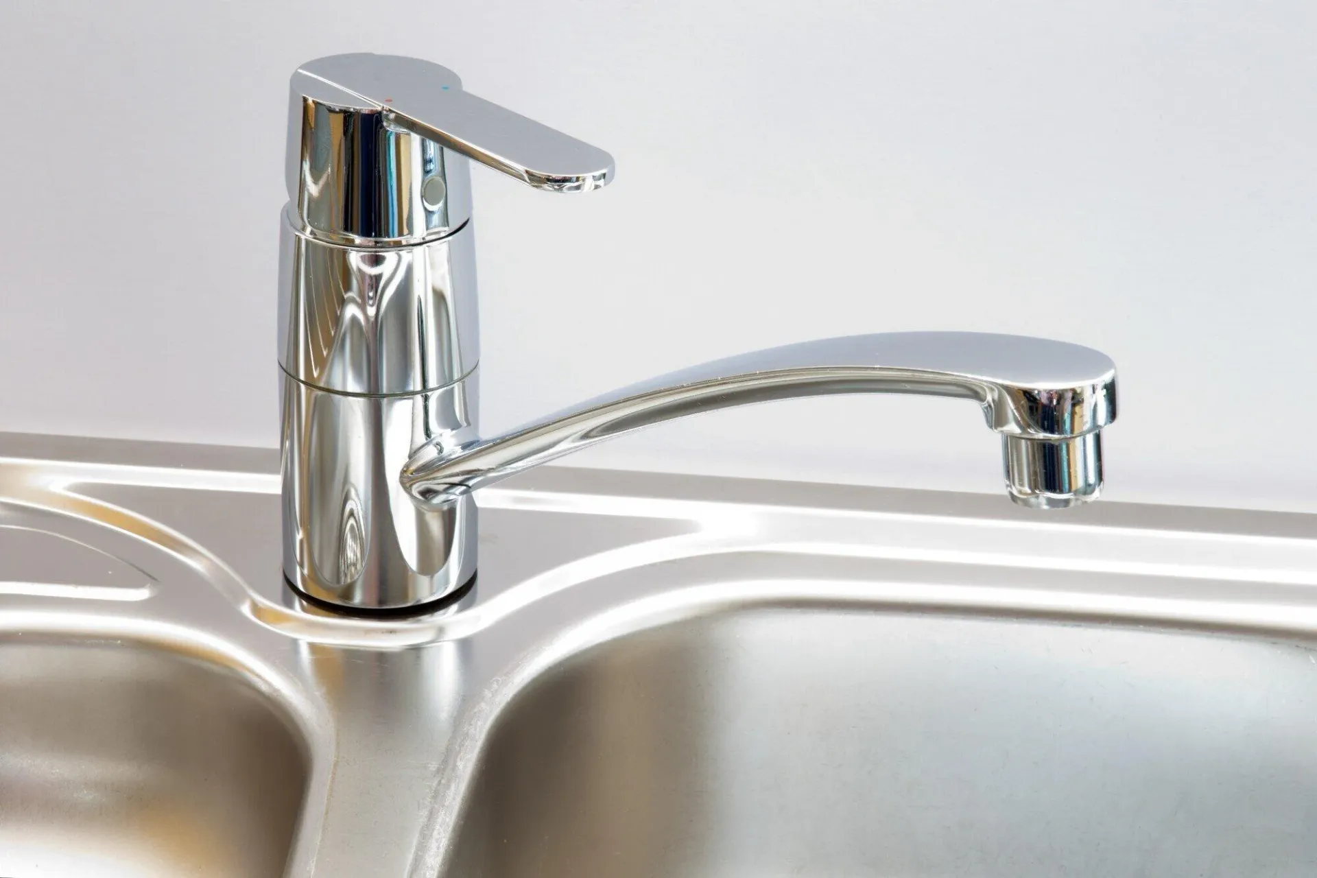 Chrome faucet on a stainless sink