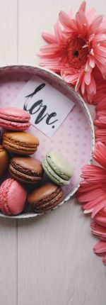 Colorful macarons beside a love-themed plate - couples counseling before marriage