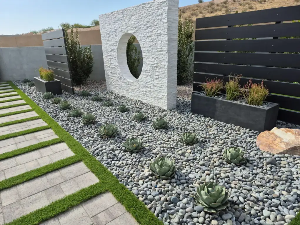 Modern Las Vegas residential landscape with water-efficient desert plantings and decorative gravel hardscape