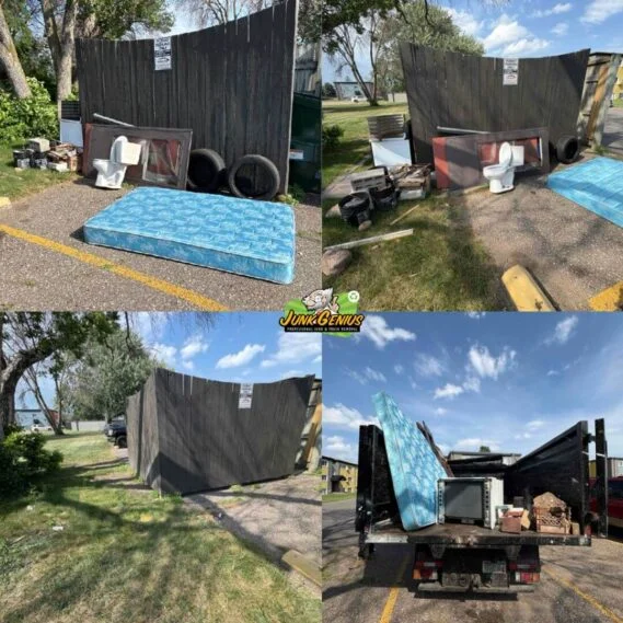 Junk removal service in progress, showing a loaded dump truck with collected items including mattresses, tires, and miscellaneous debris at a residential location.