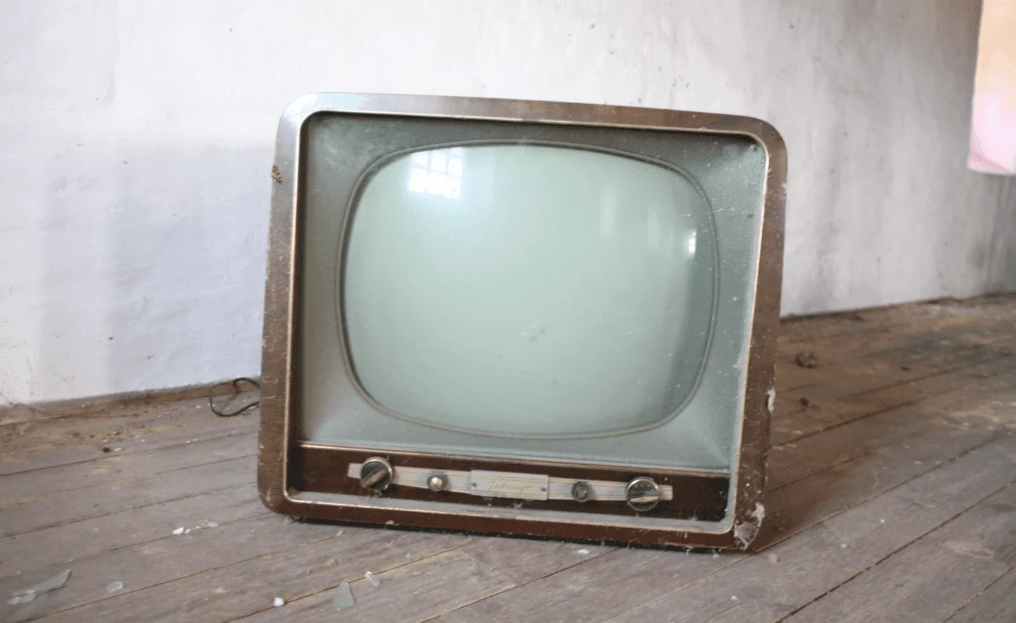 Vintage CRT television set displayed on a wooden floor, representing electronic waste suitable for junk removal.