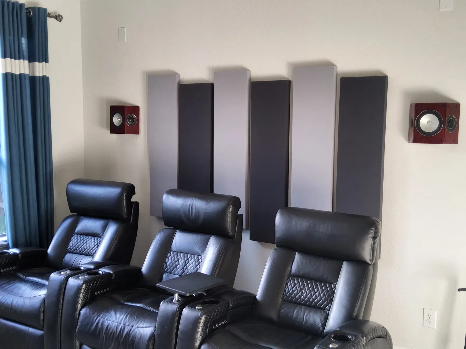 Acoustic panels hung in a home theater