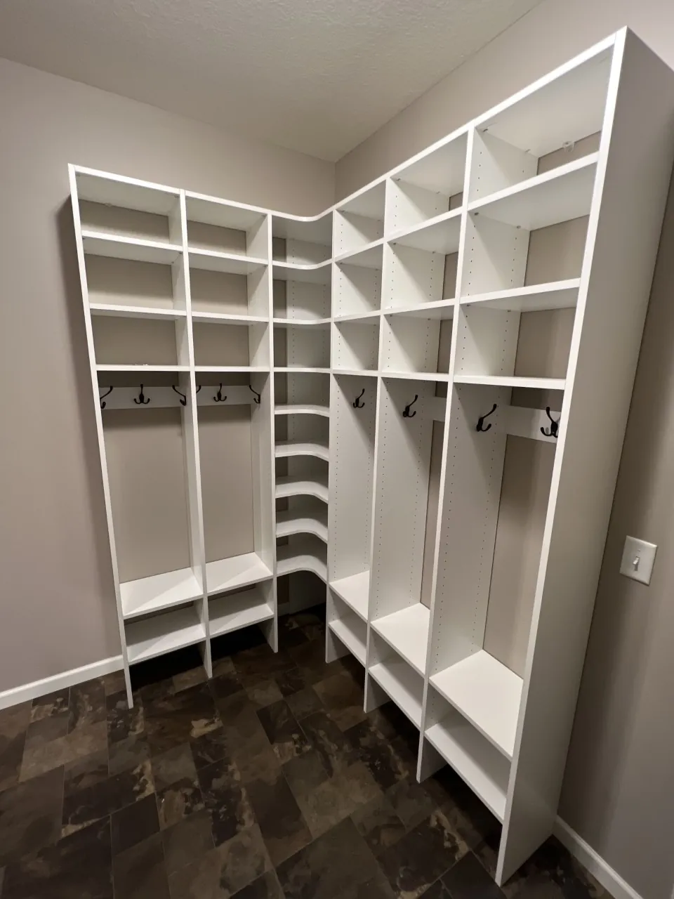New closet with cubbies, shelves and hanging rods