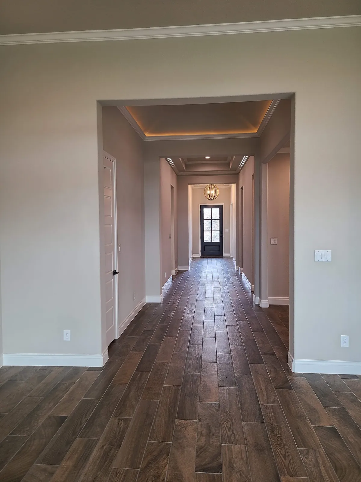 Long hallway with wood-look tile