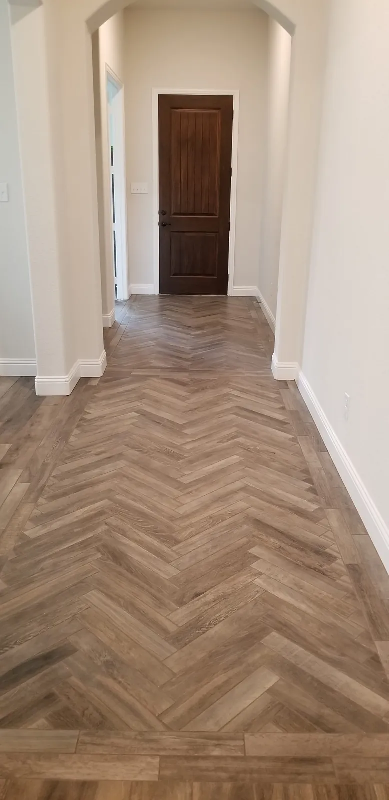 Hallway with herringbone wood-look tile
