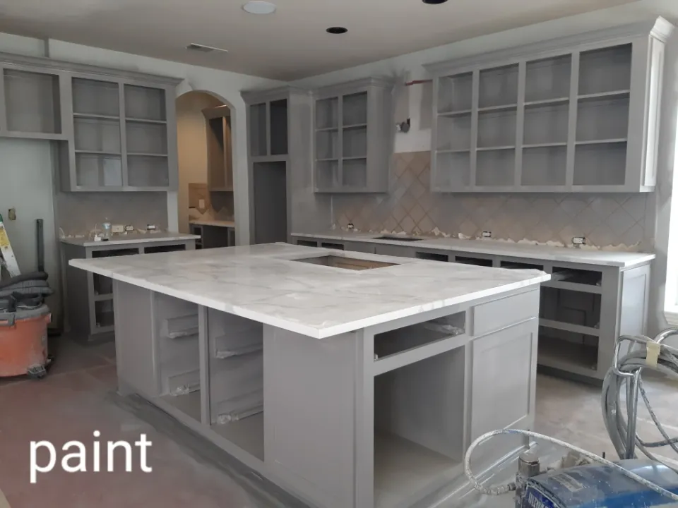 Kitchen island partway through painting
