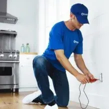 Handyman Connection craftsman at work in a kitchen