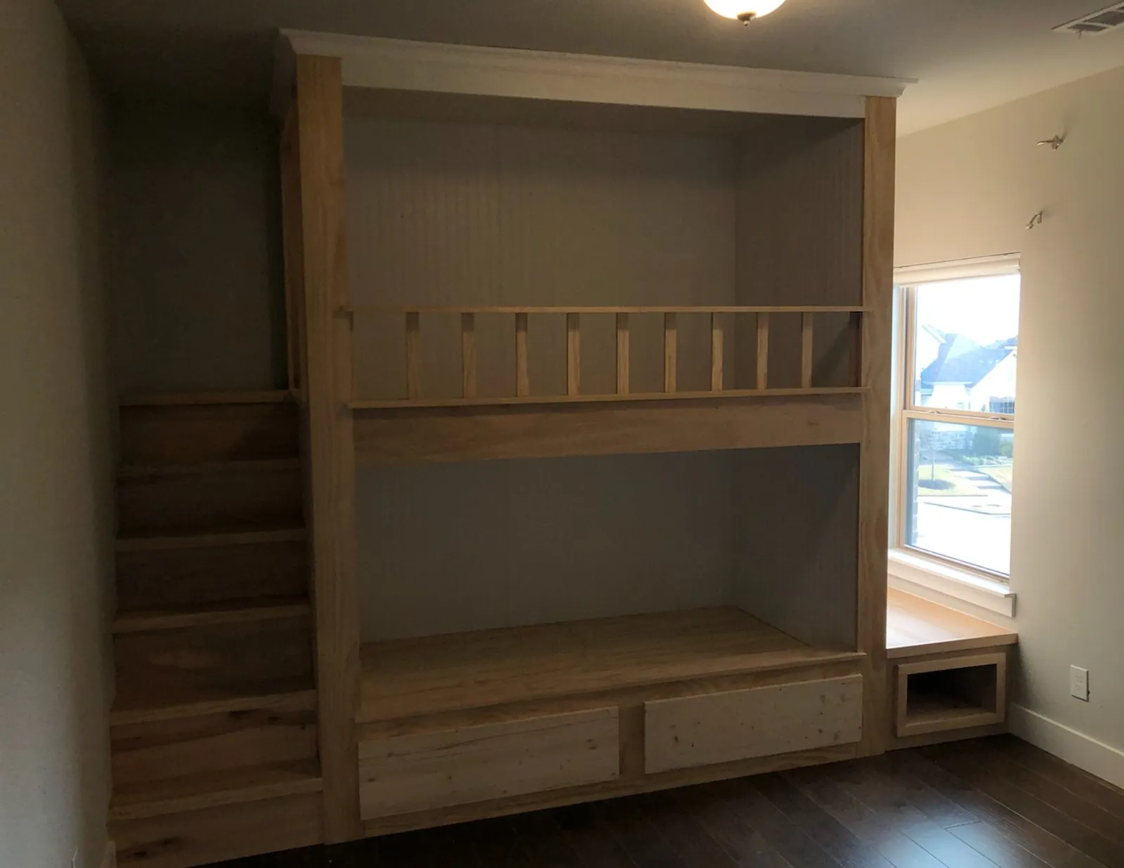 Built-in loft bunk with stairs and drawers