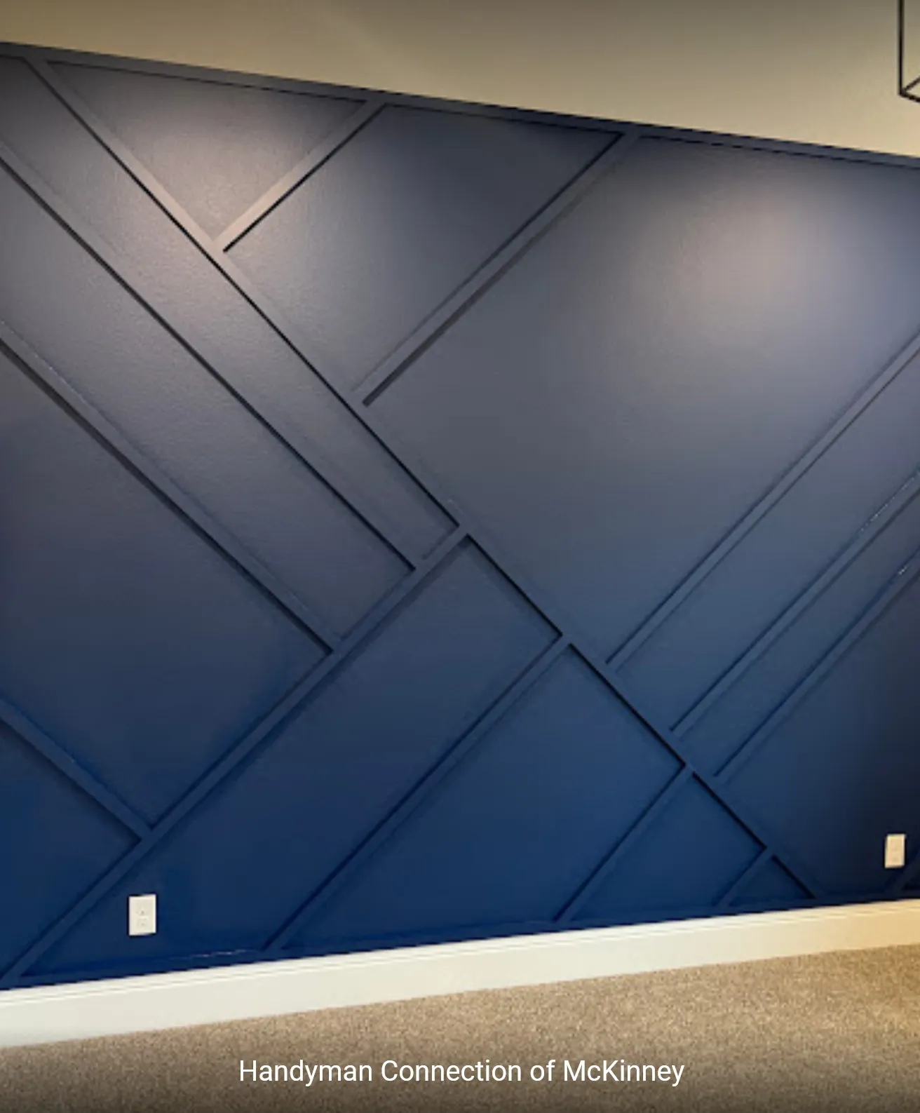 Navy painted geometric trim feature wall