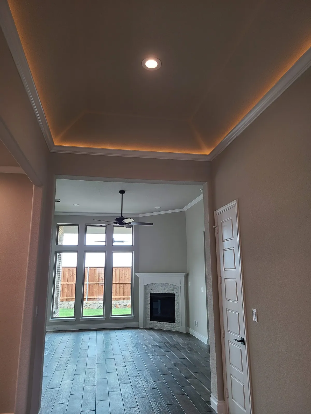 Hallway with crown molding and fresh paint