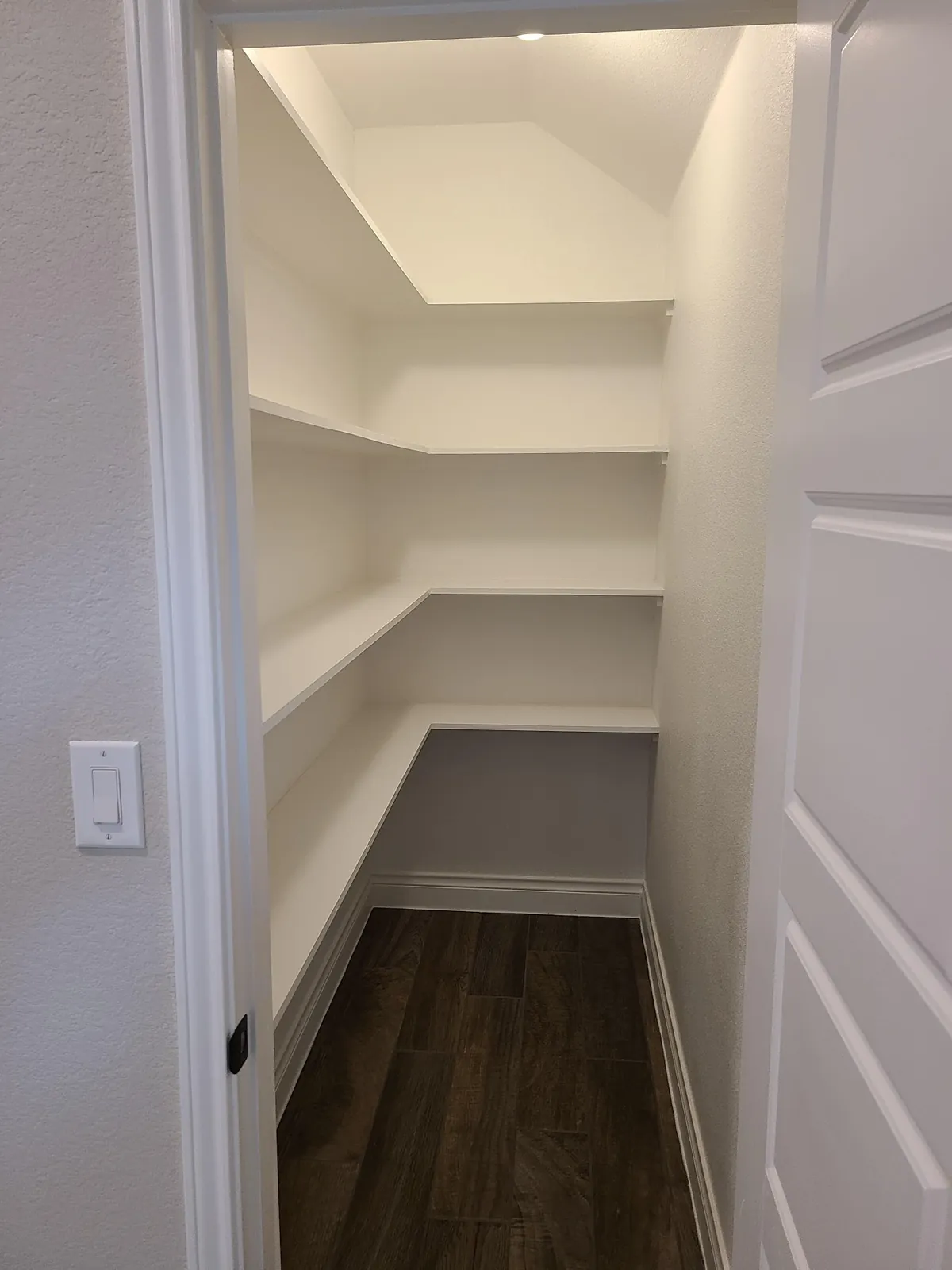 Wraparound white pantry shelving