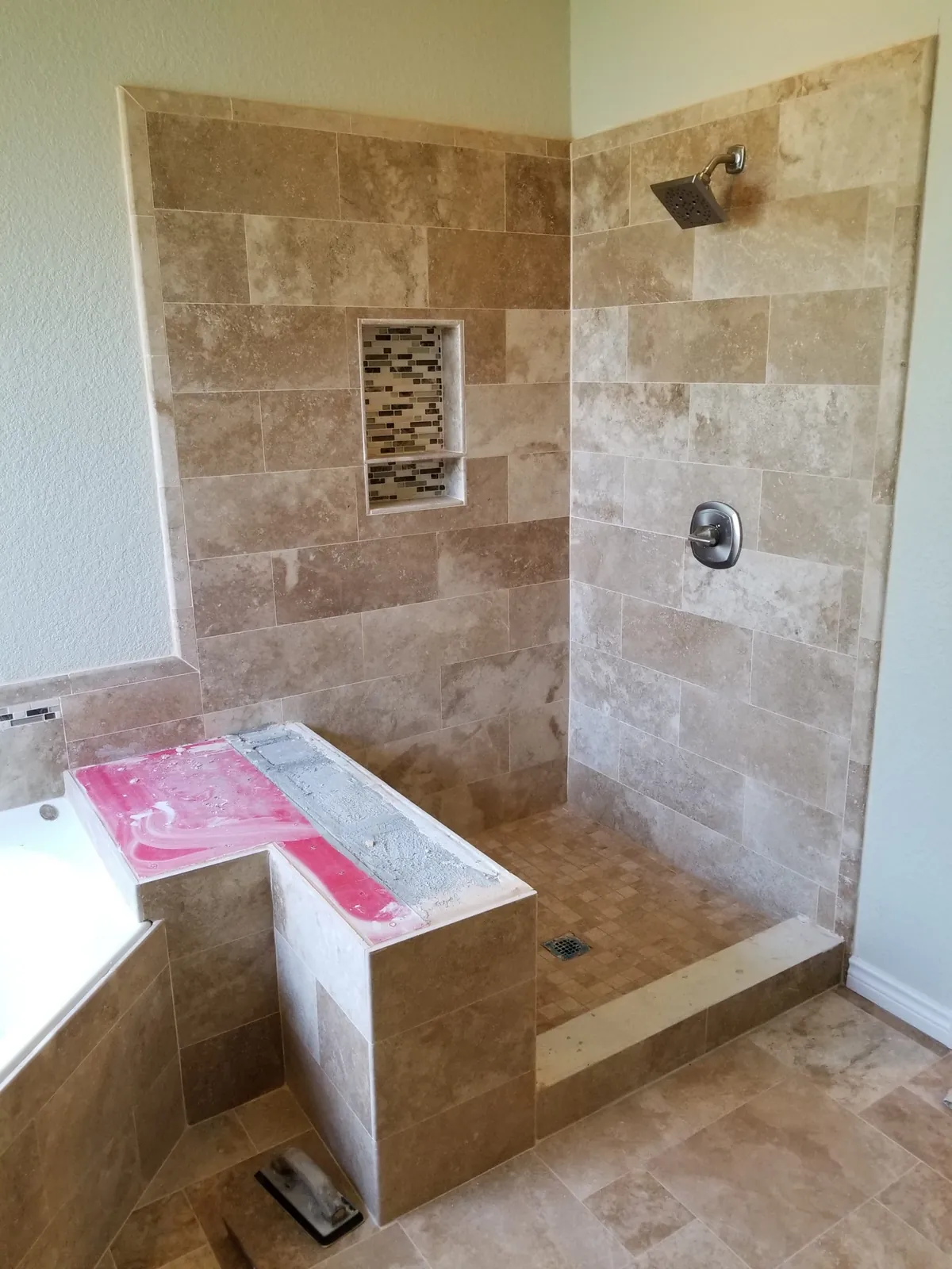 Travertine shower going in