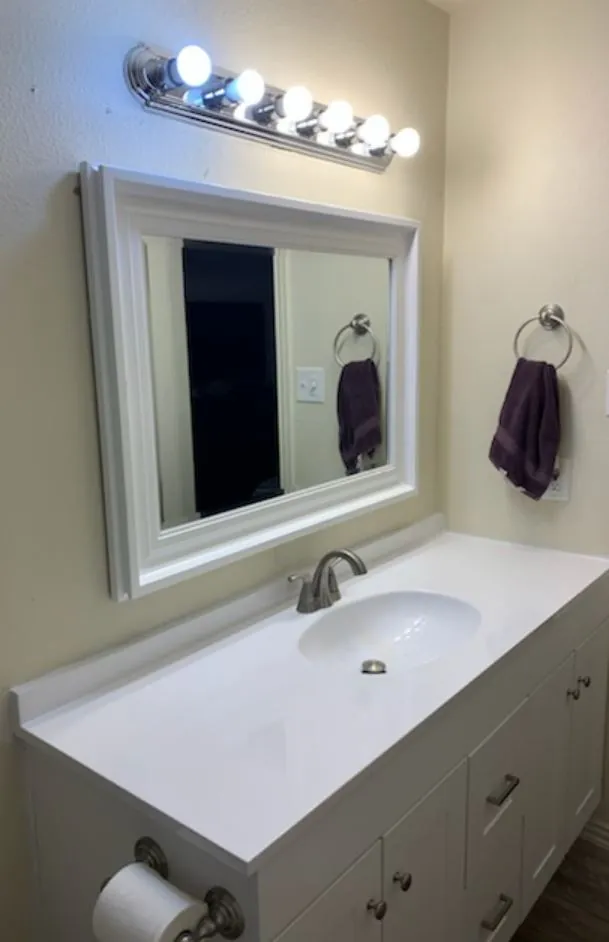 White vanity with new mirror
