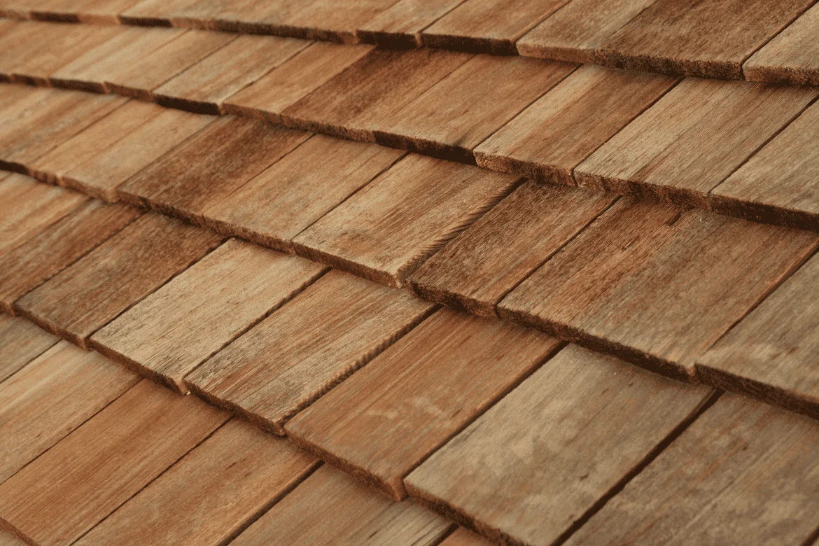 Wood shake shingles installed on a residential roof, shown in close-up detail.