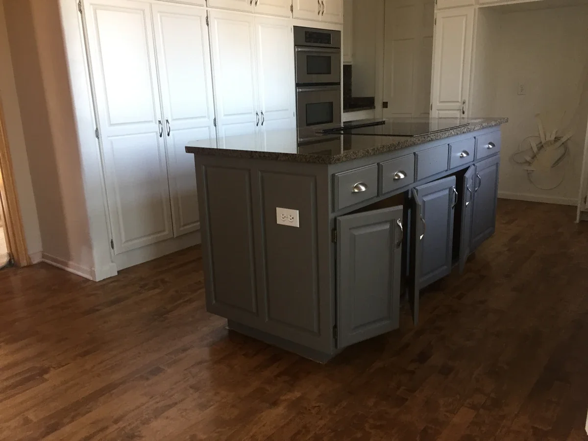 Custom-finished kitchen cabinetry with a large island