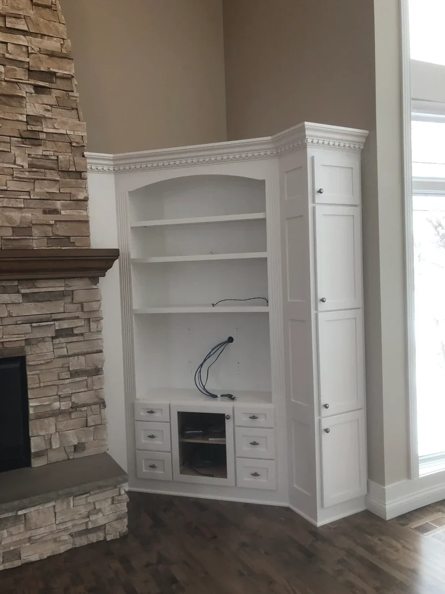 White built-in cabinetry with open shelving