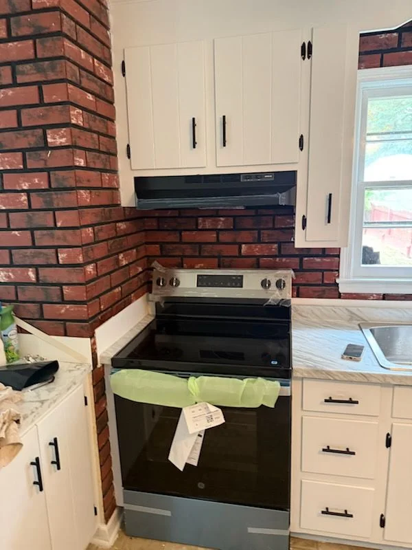 Kitchen remodel featuring white cabinetry