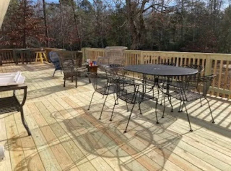 Newly constructed wooden deck with outdoor seating