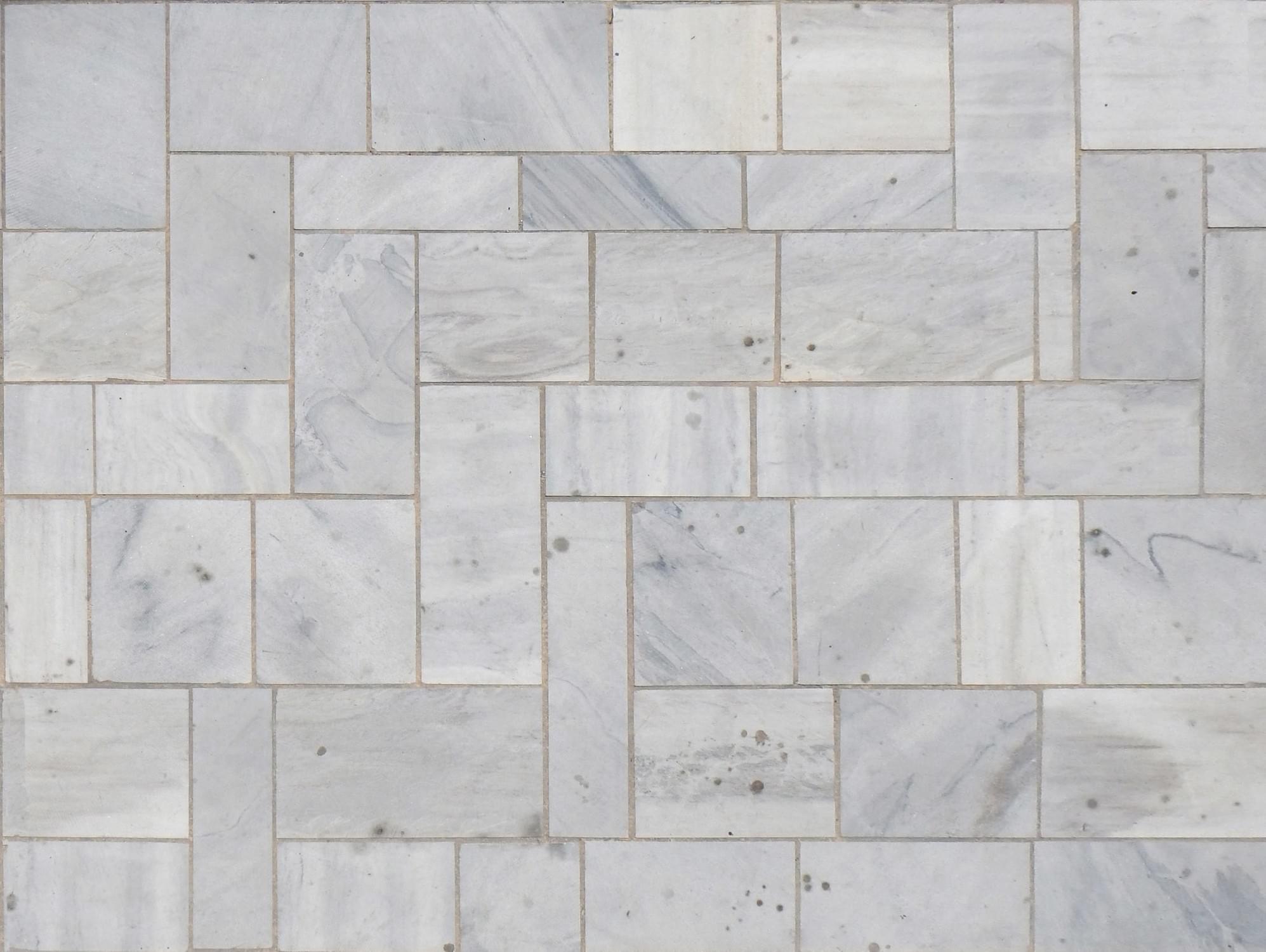 Tile floor repaired and regrouted in a Twin Cities home, with clean even grout lines